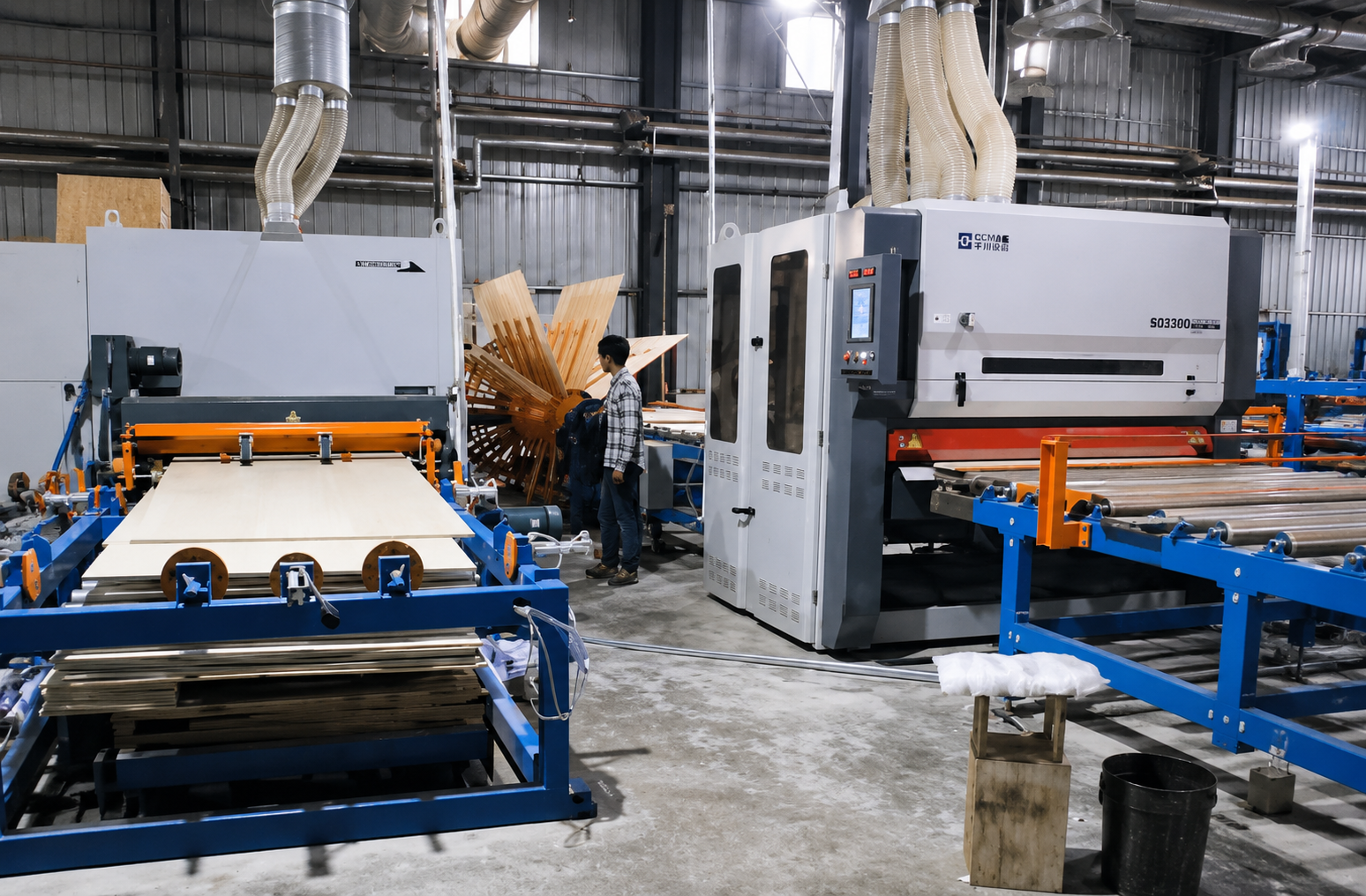 Wood-based panel sanding machine for wide abrasive belt applications