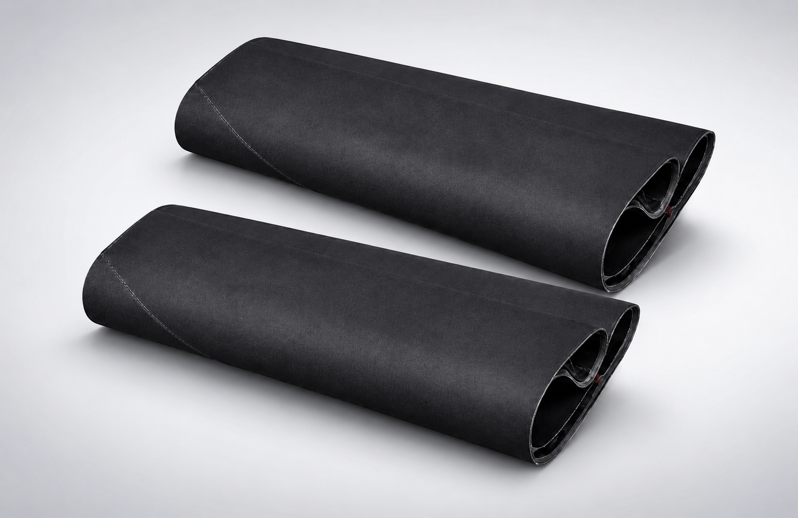 Ultra-wide sanding belt for engineered wood panels
